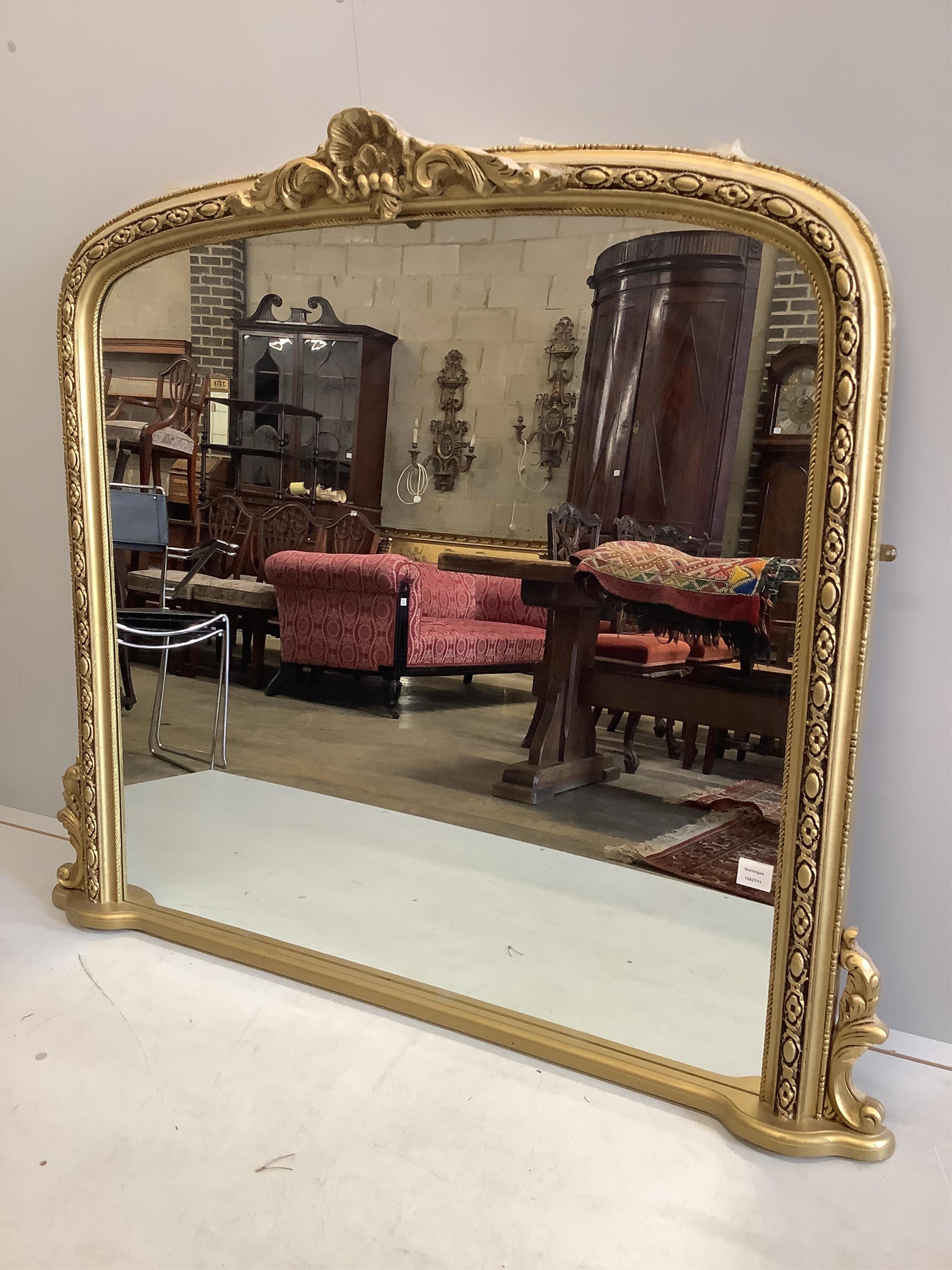 A Victorian style gilt framed overmantel mirror, width 136cm, height 119cm. Condition - good
